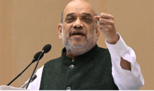 காந்திநகரில் நடைபெற்ற நிகழ்ச்சியில் பேசும் மத்திய உள்துறை அமைச்சர் அமித்ஷா