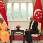 சிங்கப்பூர் மற்றும் ஜப்பான் பயணத்தின் போது யோகி ஆதித்யநாத் வெளிநாட்டு தலைவர்கள் மற்றும் நிறுவன பிரதிநிதிகளுடன் சந்திப்பு நடத்தும் காட்சி.