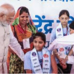 அஜ்மீரில் நடைபெற்ற நிகழ்ச்சியில் பிரதமர் நரேந்திர மோடி இலவச HPV தடுப்பூசி திட்டத்தை தொடங்கி வைக்கும் காட்சி.