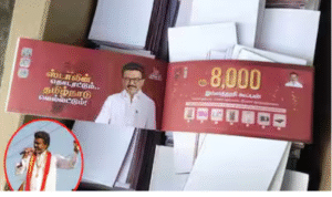 விஜய் திமுகவின் ₹8000 கூப்பன் திட்டத்தை விமர்சித்து பேசும் காட்சி