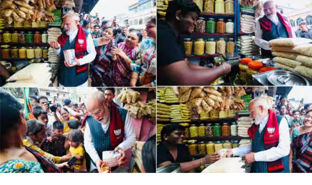 மேற்கு வங்கத்தில் சாலையோர கடையில் ஜல்முரி வாங்கும் பிரதமர் மோடி